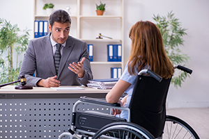 A person in a wheelchair talking to a person